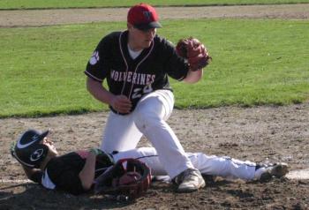 Pitcher Conlon Ranta tags out the runner attempting to score during the Wolverines’ game with Brunswick. PHIL DI VECE/Wiscasset Newspaper