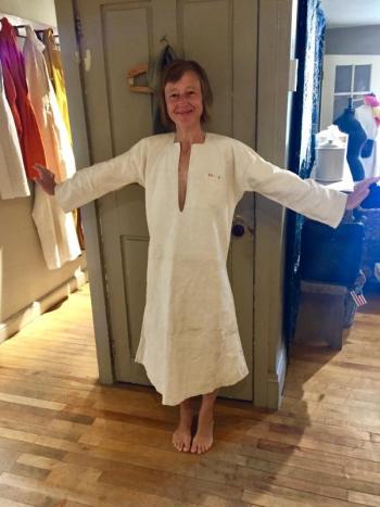 Loulou Harris models one of the 19th century handwoven linen chemises she bought at the Marston House on Aug. 8. SUZI THAYER/Boothbay Register