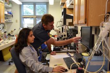 Dr. Joe Thompson and his intern Rashi Anand conducting an experiment on squid muscles at the Darling Marine Center in Walpole. Courtesy of Aliya Uteuova
