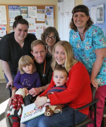 Lincoln Medical Partners physicians and medical assistants gave the 20,000th free book to two-year-old Lev Martin while he was at the Damariscotta pediatrics practice for a well child visit with his mom and sister. Back row: Kara Dow, Dr. Joann Kaplan, and Erin Smith; front: Anastasia Martin, Dr. Andy Russ, Ekaterina Martin, and Lev Martin. Courtesy of Lincoln Health