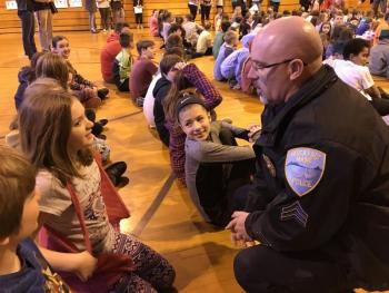 Fifth grader Kassidy Burton talks with School Resource Officer and Wiscasset Police Sgt. Craig Worster as fifth grader Brianna Farrin, center, looks on. SUSAN JOHNS/Wiscasset Newspaper