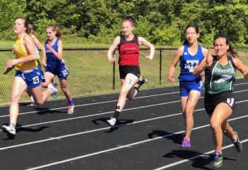 Gwen Webber, center, competes in the 100. Courtesy of Josiah Winchenbach