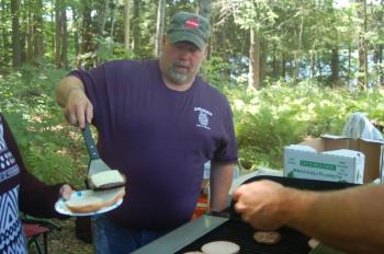 Fire Chief Steve Lilly serves a burger. ART MAYERS/Wiscasset Newspaper