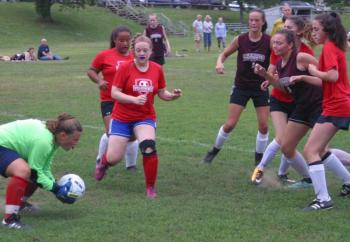 Wiscasset goalie Lily Souza recorded a dozen saves vs. visiting Monmouth including this one in a scramble in front of the net. PHIL DI VECE/Wiscasset Newspaper