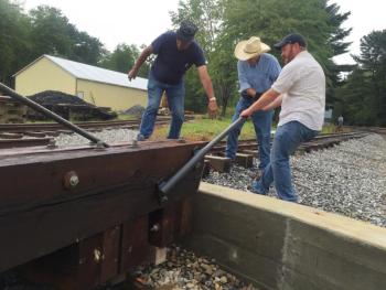 From left, Roger Whitney of Alna, Michael Ross of Fort Worth, Texas, and Erik Greene of Philadelphia, Pennsylvania work a turntable. SUSAN JOHNS/Wiscasset Newspaper