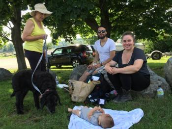 Clockwise from left, Wendy Schlotterbeck with her labradoodle Lola, Sebastian Ponce, Hannah Schlotterbeck, and Hannah's and Sebastian's 11-week-old, Rafael, enjoy lunch on
Wiscasset's waterfront Aug. 5. SUSAN JOHNS/Wiscasset Newspaper