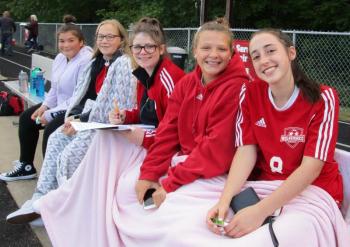 D’Nisha Dawkins, Riley Trask, scorekeeper Sam Lakin, Lily Souza and Kayla Cossette are pictured from left prior to the start of Saturday’s game. PHIL DI VECE/Wiscasset Newspaper