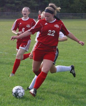 Wolverine Ellie Pratt in action against Hall-Dale. That’s Gwen Webber behind her. PHIL DI VECEWiscasset Newspaper