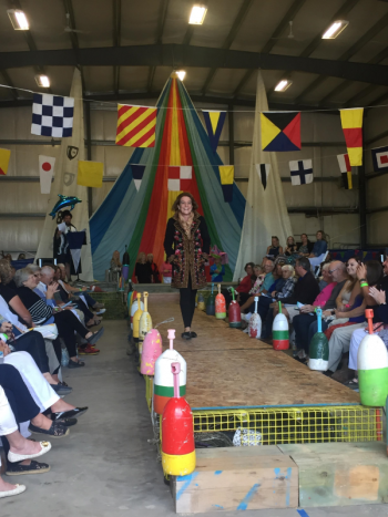 Stacey Laird on the runway modeling for Slick’s Boutique. LISA KRISTOFF/Boothbay Register
