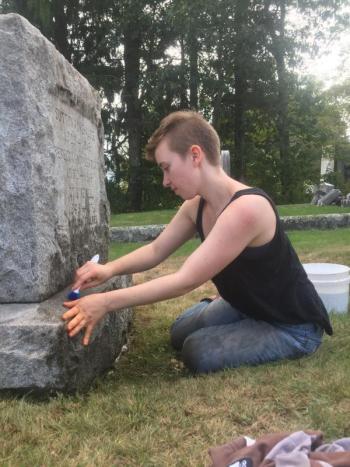 Kennedy Schoonover cleans a stone at Alna Cemetery Sept. 13. SUSAN JOHNS/Wiscasset Newspaper