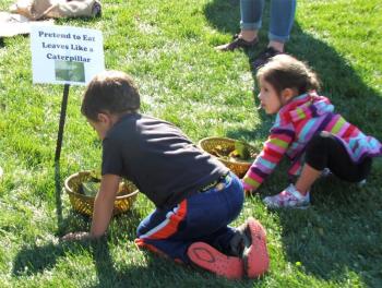 These two young ones are getting themselves ready to pretend to eat leaves like a caterpillar. LISA KRISTOFF/Boothbay Register The Great Pumpkin Hunt at Coastal Maine Botanical Gardens Oct. 20.