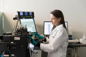 Bigelow Laboratory scientist Nicole Poulton sorts microbes in the institute's Single Cell Genomics Center. A new $6 million project will connect the genetic makeup of individual microbes to their environmental roles and build economic capacity in Maine, New Hampshire and Nevada. Greta Rybus photo