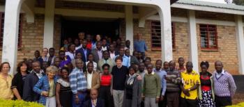 Robert Fritz (tall, white man, front center row) finally meeting many of the people who adopted his creative approach at URDT (Uganda Rural Development and Training Programme) in Uganda. Courtesy of URDT