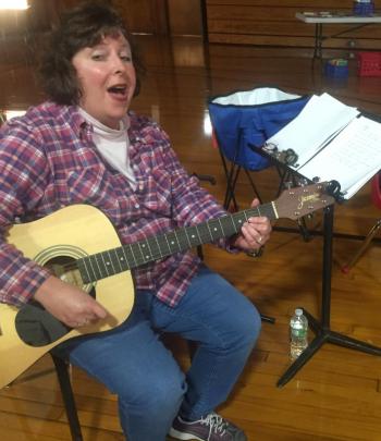 Music teacher Carole Drury sings songs students have been learnIng this school year. SUSAN JOHNS/Wiscasset Newspaper