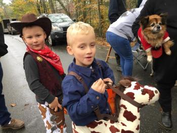Newcastle twins Bow Verney, left, and Garrett Verney, 5, attend Trick or Treat Street as a cowboy and horse. SUSAN JOHNS/Wiscasset Newspaper