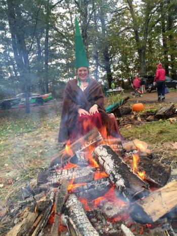 Alna’s Ruth Jones, as a gnome, keeps a fire going during Trick or Treat Street. SUSAN JOHNS/Wiscasset Newspaper