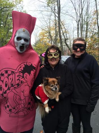 Some of Alna’s Verneys, from left, Road Commissioner Jeff Verney, wife Janet, with Lucky the chihuahua, and Jeff and Janet’s daughter Kristina Verney have Halloween fun as part of Alna Snowmobile Club’s contingent at Trick or Treat Street. SUSAN JOHNS/Wiscasset Newspaper
