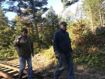Massachusetts' Pete Barrington, left, and New Hampshire's Kenneth Steeves take part in the fall work weekend. SUSAN JOHNS/Wiscasset Newspaper