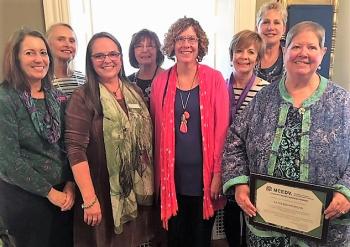 New Hope for Women’s board of directors celebrate Kathleen Morgan’s Champion of Change award from Maine Coalition to End Domestic Violence. From left are Diane Norton, Pat Aboud, Francine Garland Stark of MCEDV, Cyndi Ostrowski, Anne Conners, Sue Norton, Vera Roberts and Kathleen Morgan. Courtesy photo