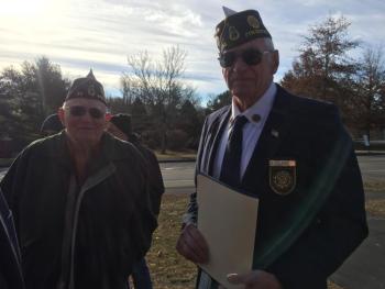 U.S. Navy veteran George Greene and Post 54 Cmdr. William
Cossette Jr. talk before the start of the service. SUSAN JOHNS/Wiscasset Newspaper