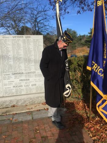 Post 54 member John Kennedy helps kick leaves away from the veterans wall. SUSAN JOHNS/Wiscasset Newspaper