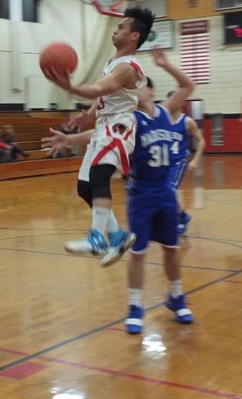 Airborne Chris Loyloa breaks for the basket. PHIL DI VECE/Wiscasset Newspaper