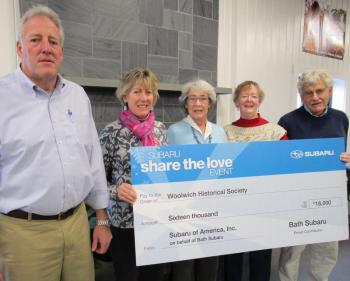 From left are Bruce, Jane and Maria McElman, Debbie Locke and Richard McElman, Jr. They are shown holding last year’s simulated check to the Woolwich Historical Society. The donation amount for this year will not be known until the promotion ends Jan. 2. PHIL DI VECE/Wiscasset Newspaper
