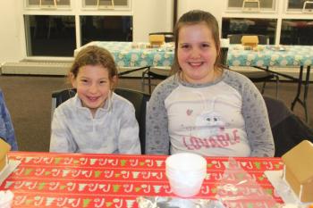 Veronika, left, and Caleigh are ready to create their personal gingerbread houses. VANESSA DUNN/Wiscasset Newspaper
