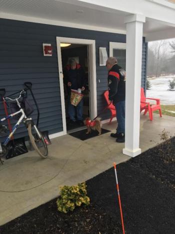 Daren Graves delivers a Rotary gift bag to veteran Robert "Bobby" Jones at Cabins in the Woods. Courtesy of Charlee Noble