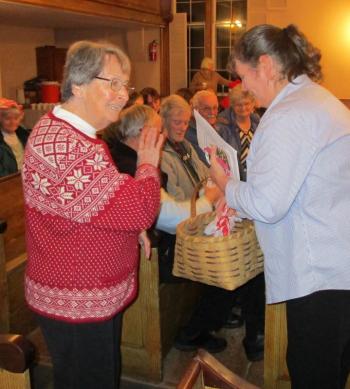 Collette Combs, left, and Tammy Given give away holiday goodies bags to kids of all ages. PHIL DI VECE/Wiscasset Newspaper