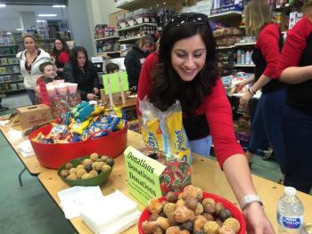Alna's Melissa Averill helps set out treats at Ames True Value. SUSAN JOHNS/Wiscasset Newspaper
