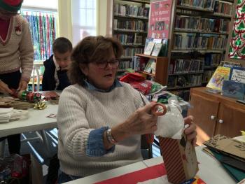 New Wiscasset resident Betsy Kyle helps at the sale inside Wiscasset Public Library. SUSAN JOHNS/Wiscasset Newspaper