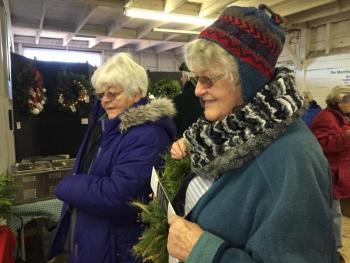 Sisters Susan Hammond of Wiscasset, left, and Brenda Simmons of Waldoboro shop the craft show. SUSAN JOHNS/Wiscasset Newspaper