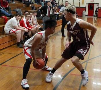 Chris Loyola takes on Monmouth’s Dylan Lajoie. PHIL DI VECE/Wiscasset Newspaper