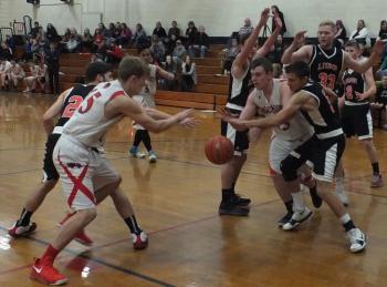 Wiscasset’s Matt Chapman and Haiden Dunning scramble for a loose ball. PHIL DI VECE/Wiscasset Newspaper