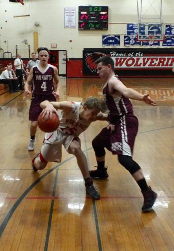 Toe to toe are Wiscasset's Matt Chapman and Monmouth Academy’s Trevor Flanagan. That’s Monmouth’s Dylan Lajoie in the background. PHIL DI VECE/Wiscasset Newspaper