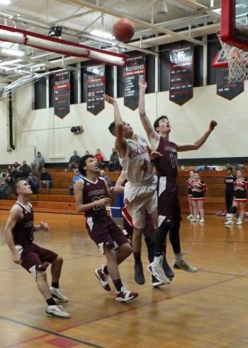 Josh Gabriele is surrounded by Bobcats during the fourth period of play. PHIL DI VECE/Wiscasset Newspaper