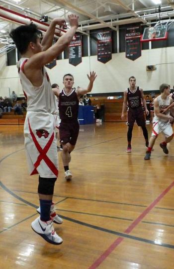 Chris Loyloa takes a shot; defending is Richmond’s Nick Adams #4. PHIL DI VECE/Wiscasset Newspaper