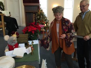 Michelle and Ed Peele add to the white gifts. SUSAN JOHNS/Wiscasset Newspaper