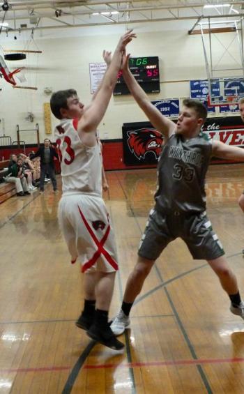 Senior Haiden Dunning scored 22 points for the Wolverines Saturday against visiting Winthrop. That’s Nate LeBlanc defending. PHIL DI VECE/Wiscasset Newspaper