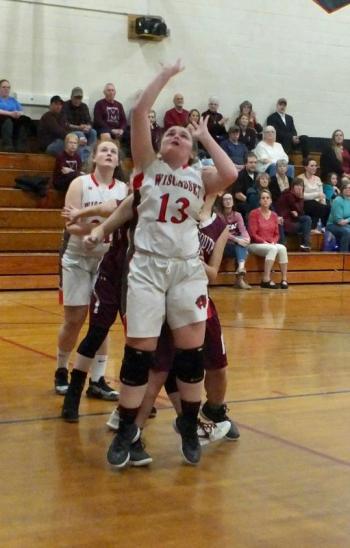 Jade Rego attempts a basket for Wiscasset. Behind her is teammate Maddy Carrier. PHIL DI VECE/Wiscasset Newspaper