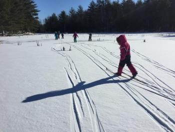 Skiing across new snow on Kidney Pond. Courtesy of Juniper Hill School
