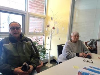 Wiscasset's Russell and Pat Cloutier mind a table of Winterfest flyers and Friends of Wiscasset Village decals. SUSAN JOHNS/Wiscasset Newspaper