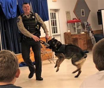 Deputy Dennsion and Duke the crime fighting German shepherd, mid-demonstration Feb. 23. Robin Ford photo