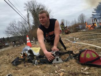 Wiscasset Fire Lt. Sam Schmal tends an airpack. SUSAN JOHNS/Wiscasset Newspaper