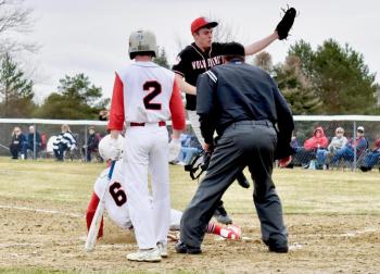 Hall-Dale’s Logan Dupont safely slides into home plate beating the throw to Wolverine pitcher Haiden Dunning. PHIL DI VECE/Wiscasset Newspaper