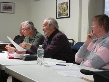 Tom Stoner, center, shares survey results with Woolwich selectmen Tuesday night. Also shown are Planning Board Chairman Gregg Buczkowski and fellow member Debbie Locke. PHIL DI VECE/Wiscasset Newspaper