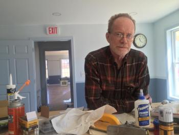 Chris Cooper pauses April 5 to show some of the work still under way. SUSAN JOHNS/Wiscasset Newspaper