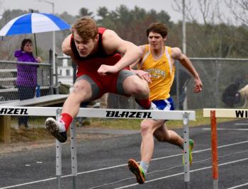 Wiscasset’s Matt Chapman won the 100-meter hurdles at Monday’s MVC track meet hosted by the Wolverines. Boothbay Region’s Quinn Ranta, also pictured placed second in the event. PHIL DI VECE/Wiscasset Newspaper