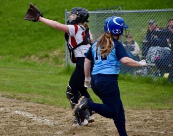 Wolverine catcher Farrah Casey catches the throw to the plate but too late to get Dirigo’s Abby Stevens in the fourth inning. PHIL DI VECE/Wiscasset Newspaper